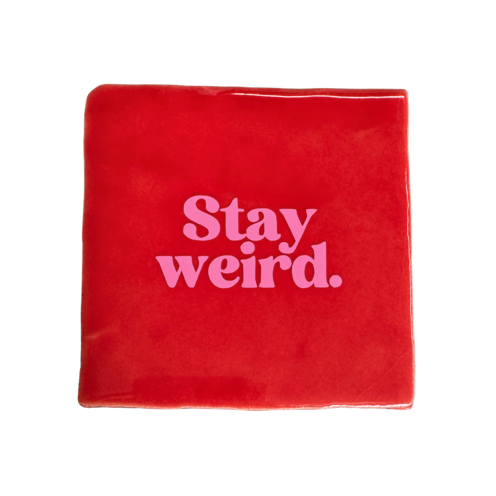 Carreau signature « Stay weird » en forme de main