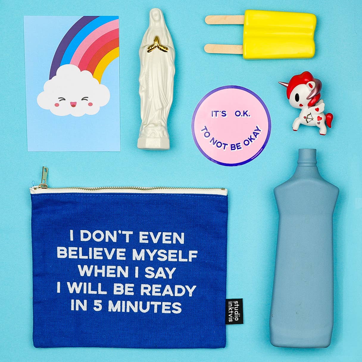 Trousse à maquillage bleue « I don't even believe »