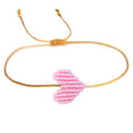 Bracelet fin avec cœur tressé rose pâle